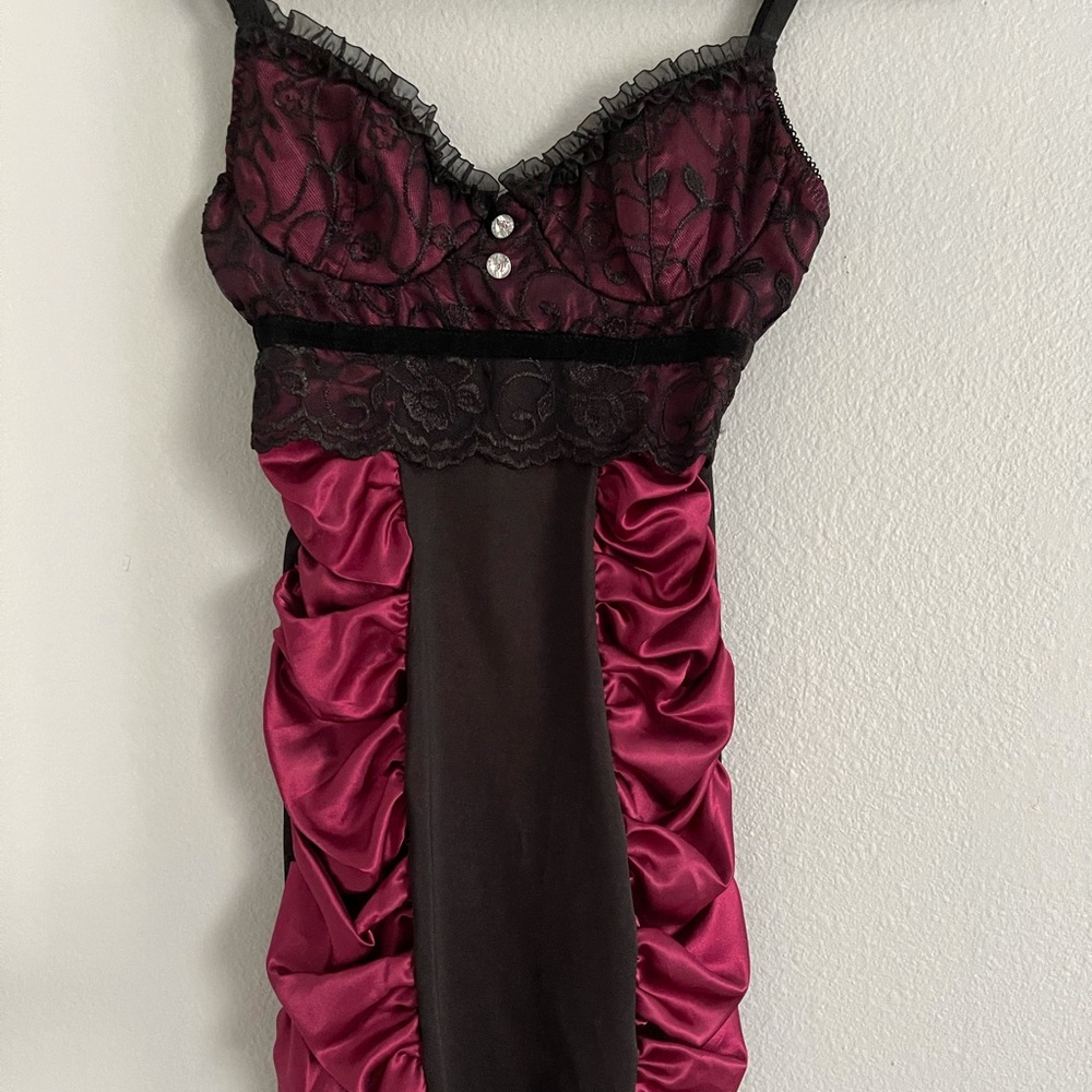Short burgundy with black dress .